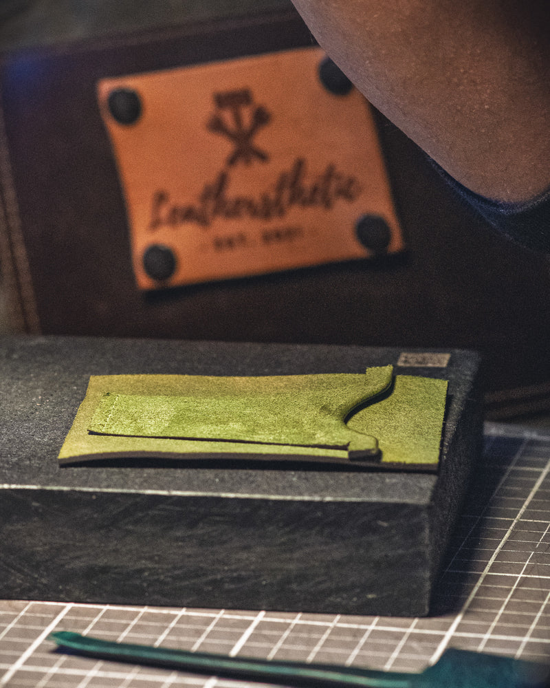 a close up shot of leather good in the making 