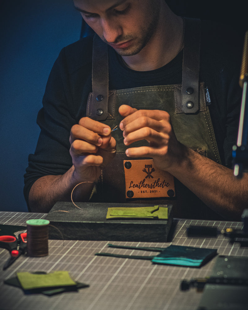 crafter working on a new leather good